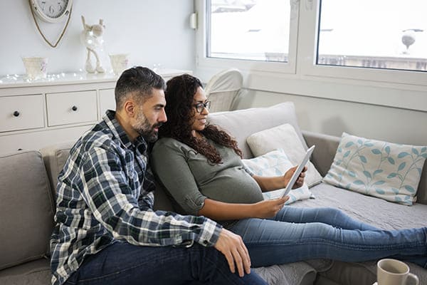 Mature couple at home, expecting baby